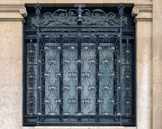 Ancient metalwork in old window, Seville, Spain.