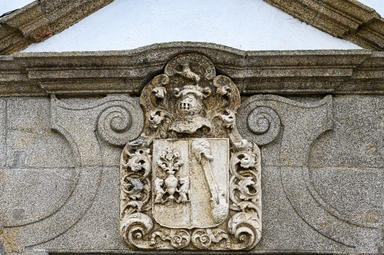 Ancient stone coat of arms with a relief carving style, decorati