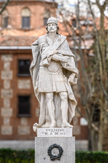 Ancient stone statue of Wilfredo el Belloso in a public park, Ma