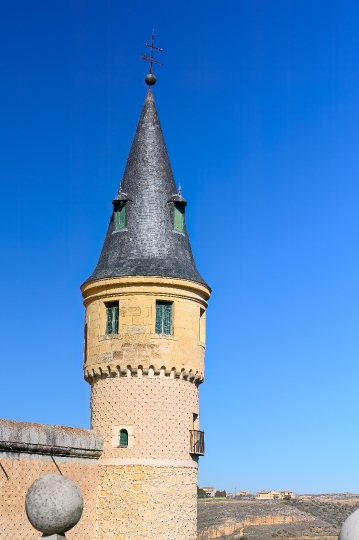 Ancient tower in blue sky, Segovia, Spain