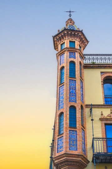 Architectural detail of a decorative tower in the corner of a bu