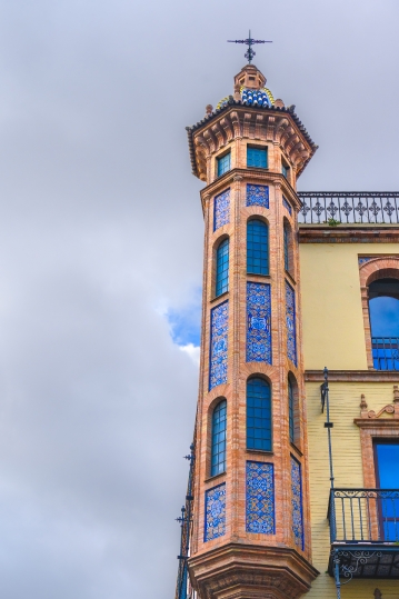 Architectural detail of a decorative tower in the corner of a bu