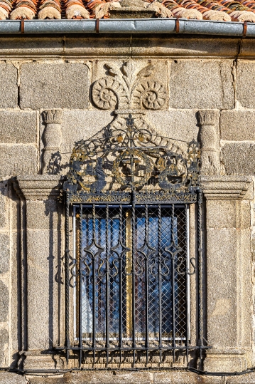 Architectural feature of an ancient window on the stone wall of