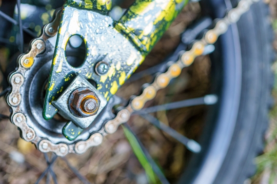 Bolt, stay, and rear gear of a childs bicycle.