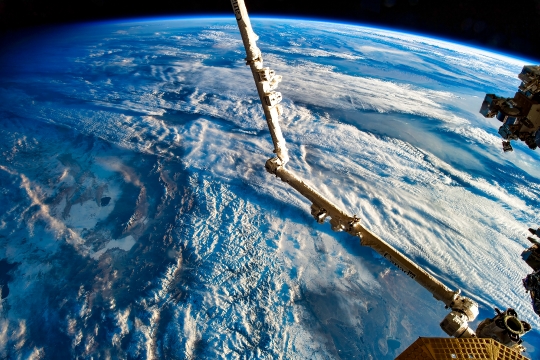 Canadarm and Weather in Planet Earth