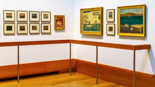 Canadian paintings displayed in a hall of the Art Gallery of Ont