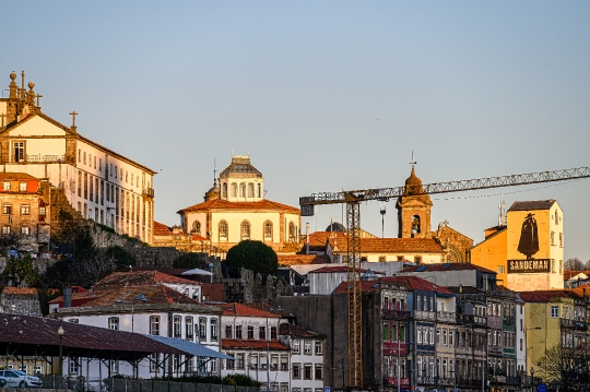 Cityscape buildings during the dusk hours, with a building featu