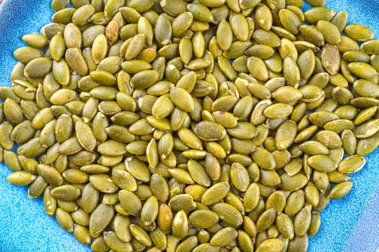 Close-up of roasted pumpkin seeds with salt.