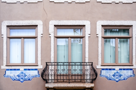 Colonial facade of building with tile decorations