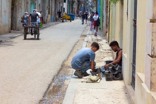 Cuban Men Working in Sidewalk