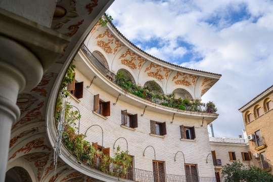 Curved facade of building in Plaza del Cabildo, Seville, Spain