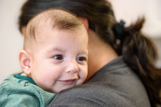 Cute baby with his mother.