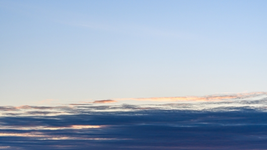 Dawn sky with a large cloud in the lower section