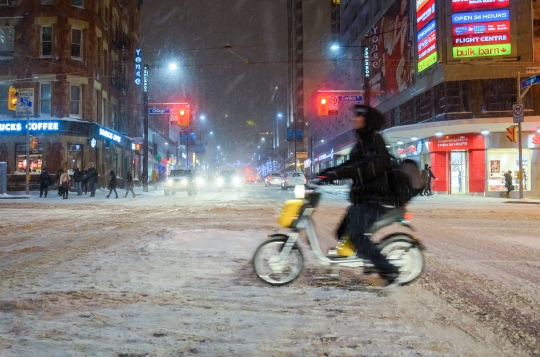 Electric Bicycle In Snow Storm