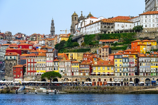 Facade of pastel-colored buildings in the riverfront district, w