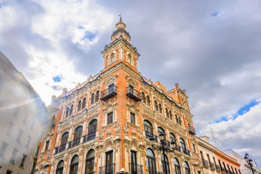 Facade of the Telefonica building with a lens flare, Seville, Sp