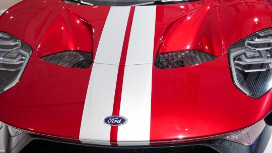 Ford Motor Company logo in red and white car