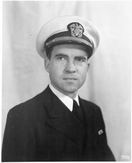 Formal portrait of Commander Richard Nixon wearing a coat and na