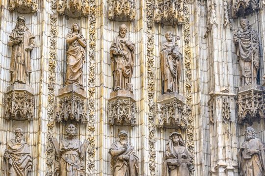 Group of religious saint statues in the facade of the medieval c