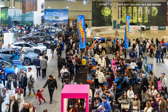 High angle view of people and cars in the exhibits.