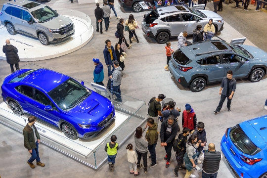 High angle view of people and cars in the exhibits.