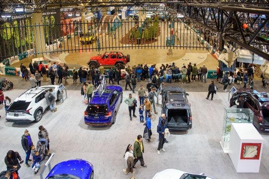 High angle view of people and cars in the exhibits.