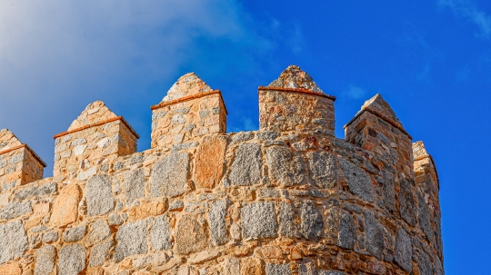 High section of a medieval fortified surrounding wall against a