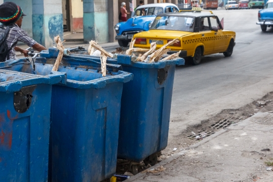 Lada Driving By City Garbage Bins