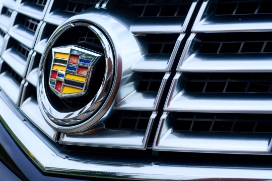 Logo of Cadillac on the grille of the car.