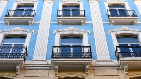 Low angle view of windows, balconies in the facade of a colonial