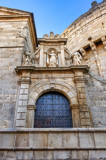 Low-angle view of the entrance door on the facade of the medieva