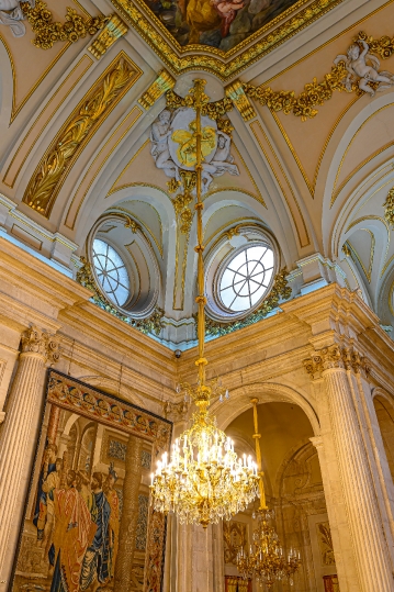 Luxurious ancient lamp hanging from the ceiling in the lobby of