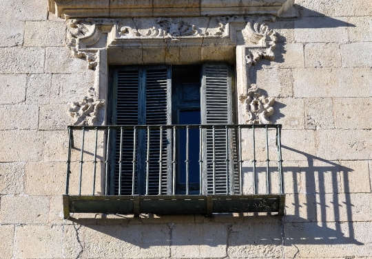 Medieval balcony with window. Facade of the City Hall building i