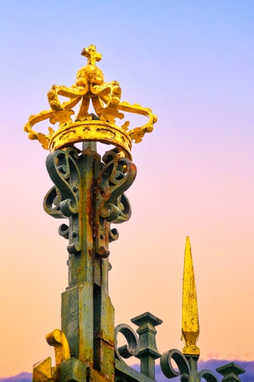 Metal crown decoration in the fence of the Royal Palace.