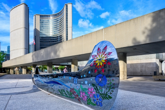 Metal sculpture of a First Nations canoe in the Spirit Garden at