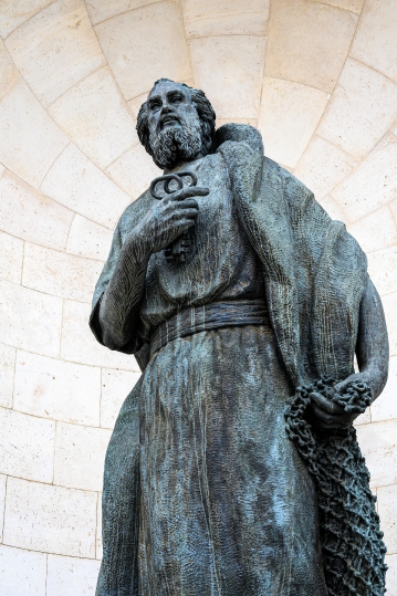 Metal statue of St. Peter in the facade of the Almudena Cathedra