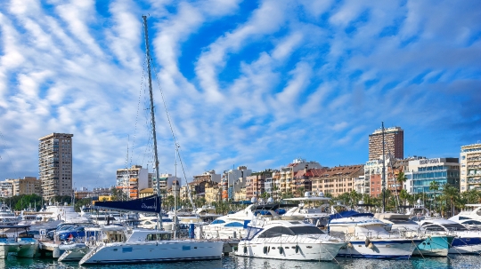 Modern Yachts in Cityscape