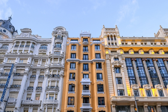 Multi-colored facade of an apartment building in Gran Via