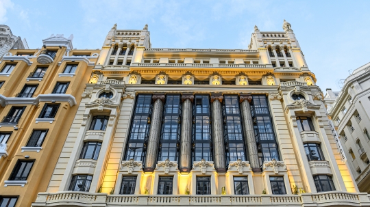 Multi-colored facade of an apartment building in Gran Via