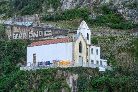 Old church building on the riverbanks of the Douro River.