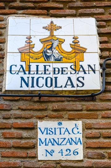 Old tile sign marking the San Nicolas Street, Madrid, Spain