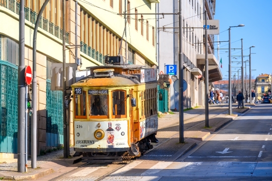 Old Tram Driving in City Street