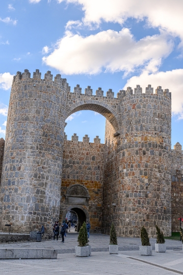 People by the medieval fortified surrounding wall, a major touri