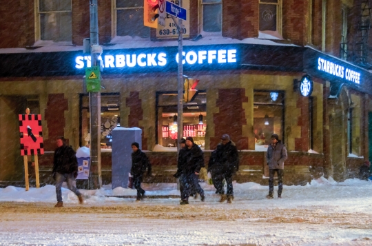 People Crossing Street in Snow Storm