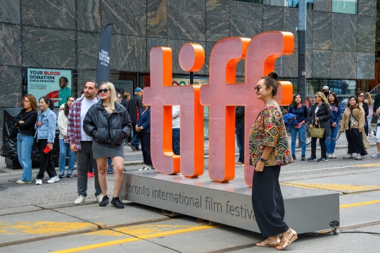 People Posing at TIFF Sign