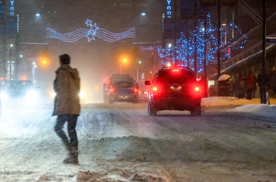 Person Crossing Street in a Snow Storm