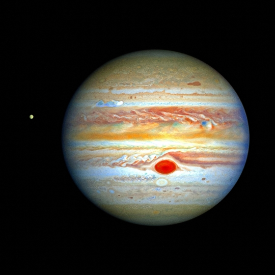 Planet Jupiter and One of its Moons