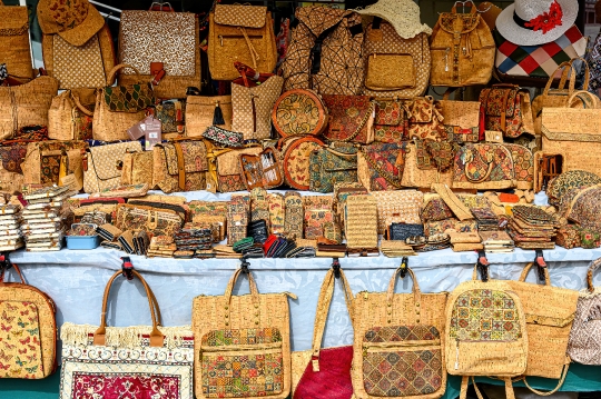 Retail display of various souvenir objects made with cork, a tra