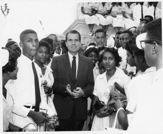 Richard Nixon stands amongst a group of 4 h members visiting Was