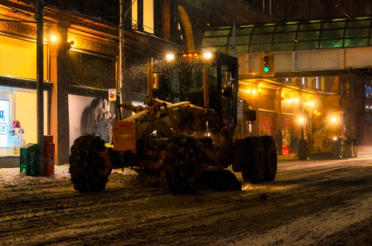 Road Grader Clearing Snow